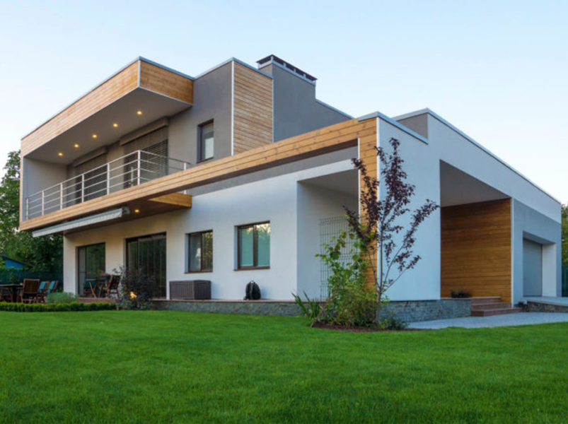 Экстерьер современного дома с зеленым газоном
